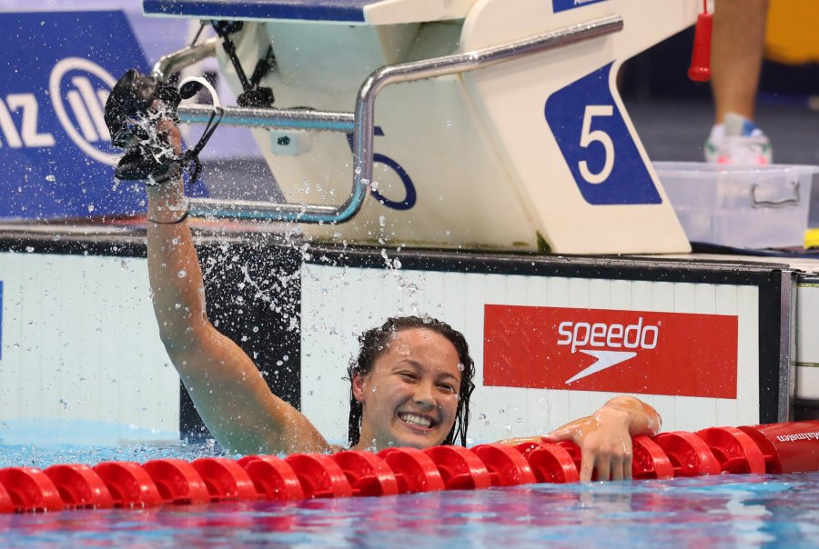 Tai powers to 100m backstroke gold